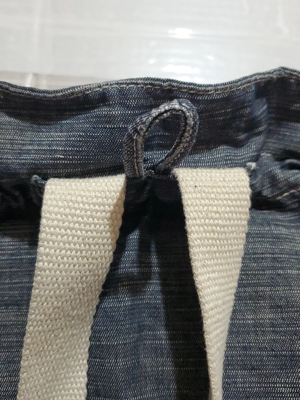 Denim-Look Drawstring Backpack with Cream Strap Details